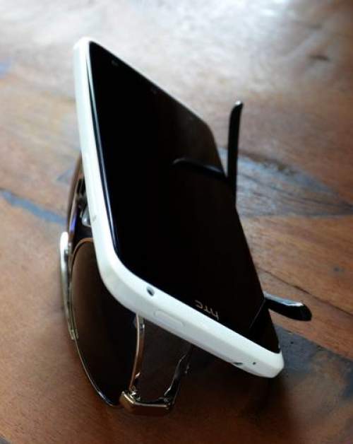 5. Turn your sunglasses upside down and set your cell phone on top. It’s an easy stand to watch videos on your phone.