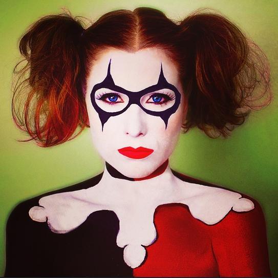 8. To look a bit soft at Halloween, paint your lips in an orange shade and draw sunglasses. Make your face look pale by applying powder. Create pigtails for the final touch.