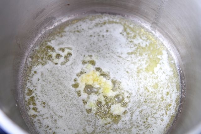Once melted, add in the minced garlic and stir.