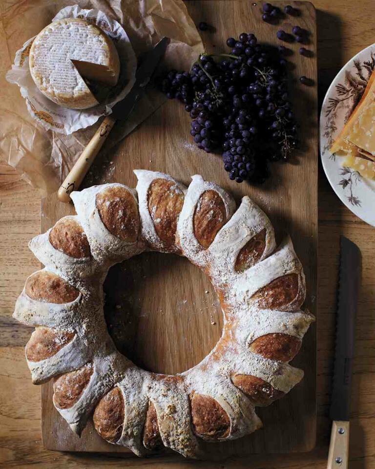 Just make a big roll out of bread dough. Cut only from one side and join the ends together to make this beautiful wreath of a bread. 