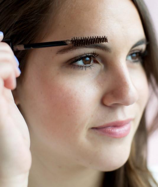 14. Create the look of thicker brows by using a mascara in the same color of your arches to darken, fill in, and set them.