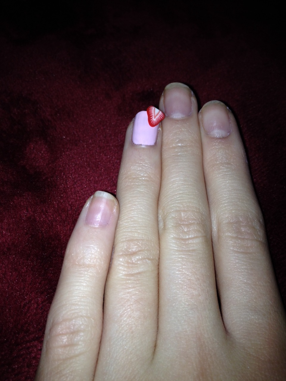 Step 7 
Take your clear coat and put it on the corner of your nail then put the strawberry down on top of it and press down ( not too hard )