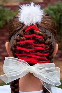 After both ends of ribbon have been tied off and the excess had been cut, you are ready to use your white wired-ribbon.  Wrap it behind both braids at the nape of the neck and then bring it around the front and tie it in a bow.  