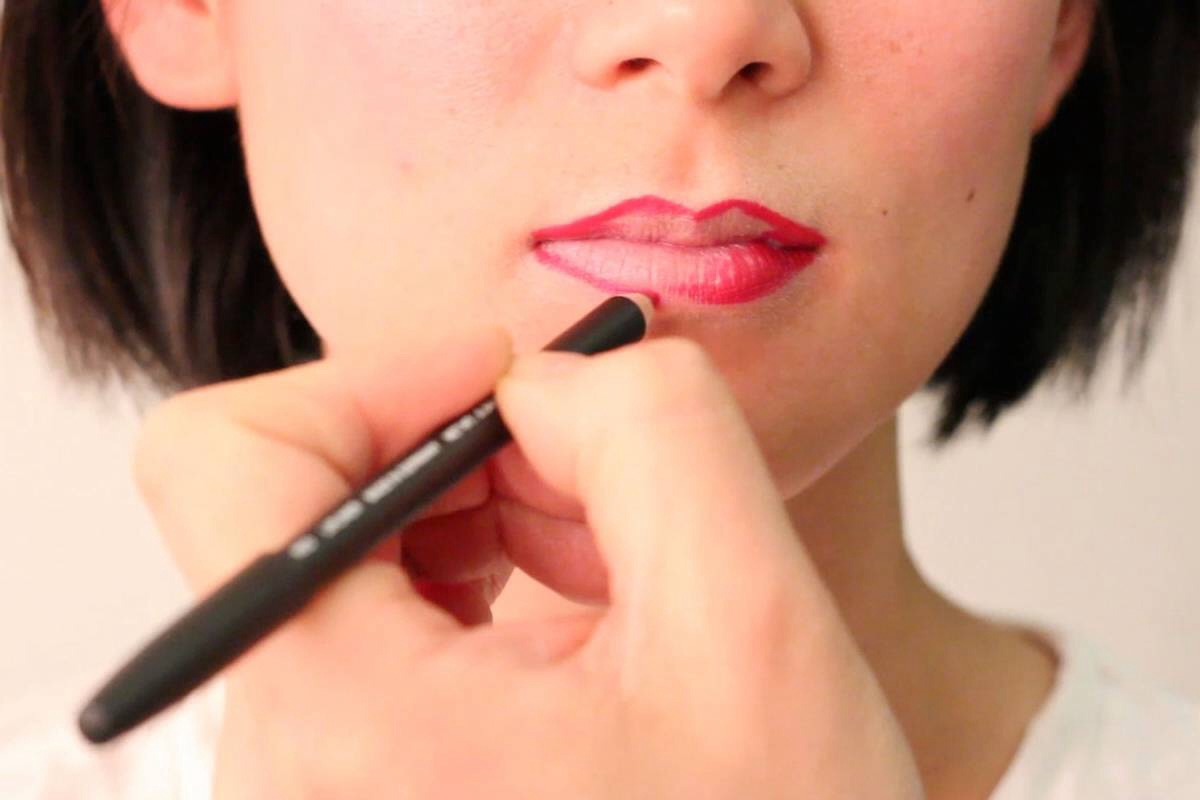 In a shade that is slightly darker than your lips, redraw the line so that it's right outside your lips. Apply lipstick, then in the center of your bottom lip apply some liquid foundation for a perfect pout. Finish it off with lip gloss to blend and seal.