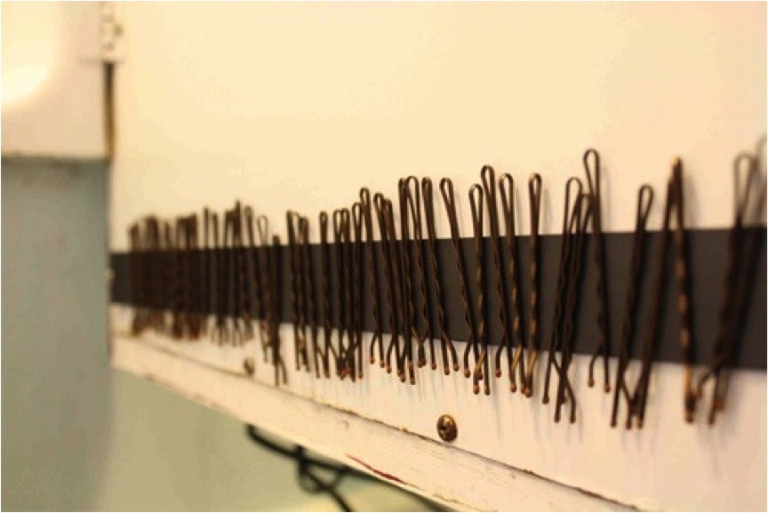 Use a magnetic strip to organize bobby pins and clips