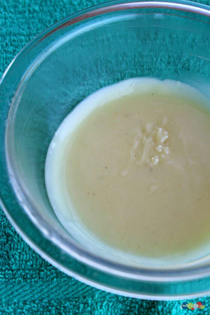 Place melted liquid in a bowl and add witch hazel and essential oils
