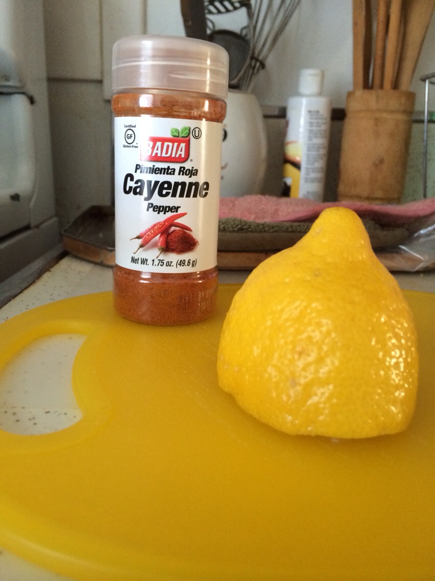 After the timer goes off, fill a pint glass with the water. Then juice half a lemon directly in the glass, and top it off with a thin layer of cayenne pepper across the top. 