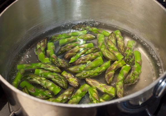 Finally, cook the asparagus tips in boiling water until tender-crisp.