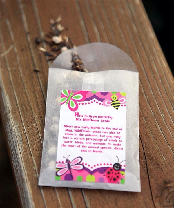I printed a template off the computer, colored the image, then cut and glued the small packets together. Add date of the wedding and the bride and groom’s name then filled each packet with seeds that would result in the flowers on the tables and the bouquets at my wedding.