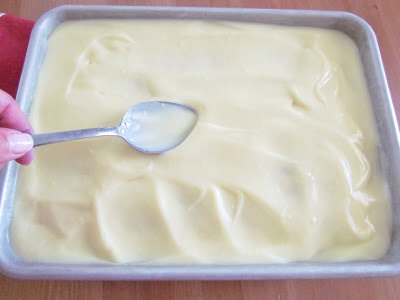 Spread it all out and using the back of the spoon gently push pudding down into the holes.