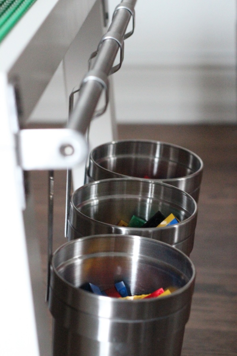 On one side, there’s a row of hanging buckets- perfect for storing project leftovers (or waiting-to-get-to’s).