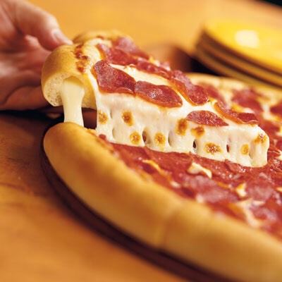 
9. Stuffed Crust Make New York-Style Pizza but before topping, place 8 string-cheese sticks along the edge and fold the dough over. Brush the stuffed crust with olive oil and sprinkle with dried oregano.