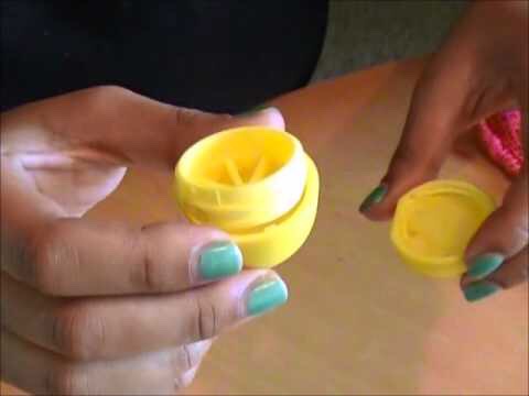 Clean out your container of EOS before you do anything (I probably should have mentioned this before... Oops)  And then pop out the wheel-looking thing. Twist the wheel thingy into the cap of the container. (It should twist in like you are twisting a cap back onto a water bottle)