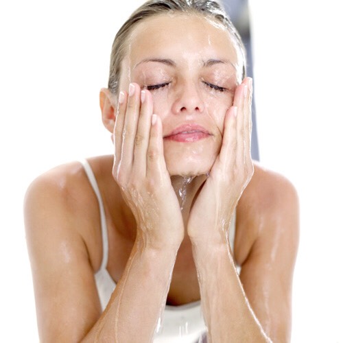 Wash your face, this will get rid of oil from shampoo and conditioner that was left on the face; use your own face wash routine.

.