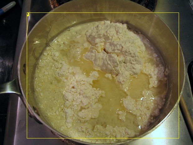 Mix all of the ingredients together, and stir over low heat. The dough will begin to thicken until it resembles mashed potatoes. 
When the dough pulls away from the sides and clumps in the center, as shown below, remove the pan from heat and allow the dough to cool enough to handle.
