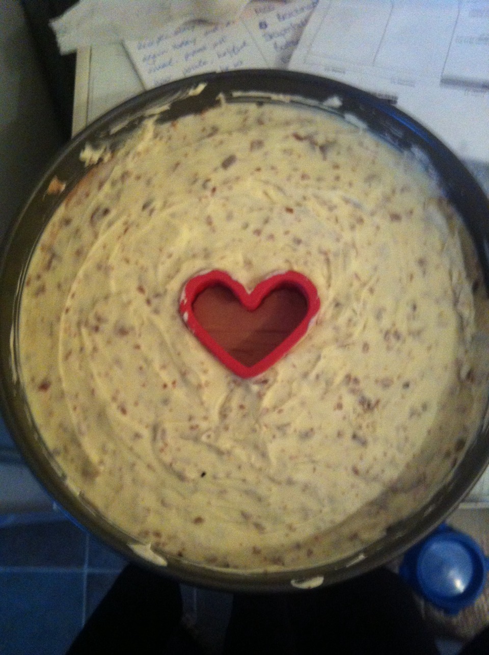 make the biscuit base and lay it down
then add the milk chocolate to the cheese and cream. Layer that down
Now place the heart cutter down, and add the white chocolate and ripple to the other half of the cheese and cream, placing it around the heart..
Now p