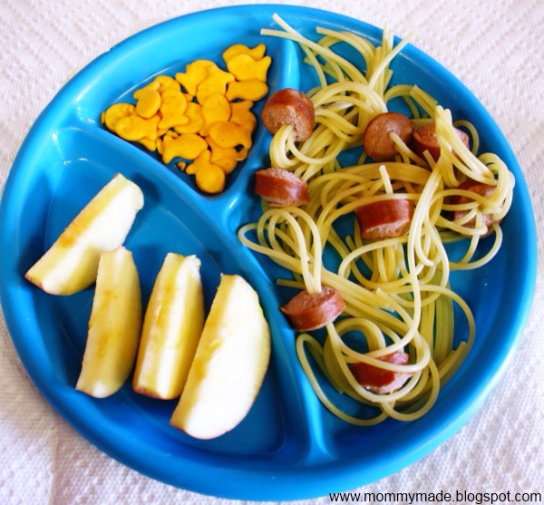 Stick multiple pieces of spaghetti through prices of cut hot dogs before cooking. 