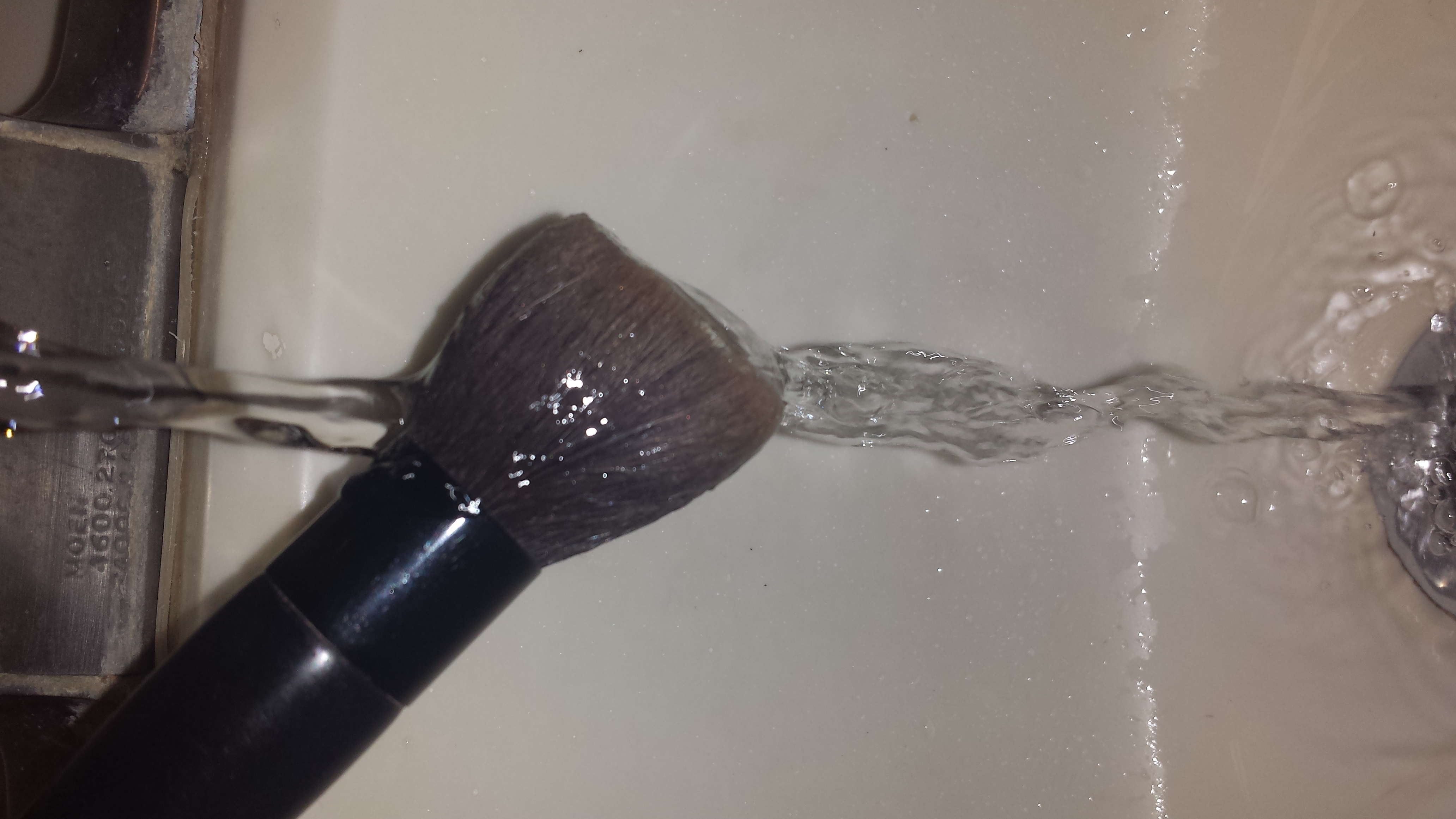 First wet your makeup brushes 