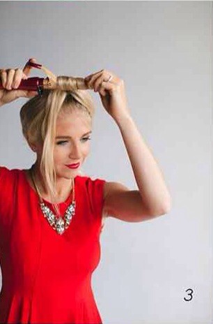 3.  With a 1-inch curling iron, wrap the curls away from your face and continue until the entire pony is curled.
