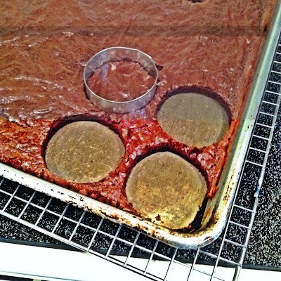 Instructions
Prepare brownie mix according to the back of the package. Spray a 12×17 jelly roll pan with non stick spray and spread the batter out. Bake at 350* for 12-13 minutes. Let cool completely. Use a 2 inch round cookie cutter to make 24 brownie circles.