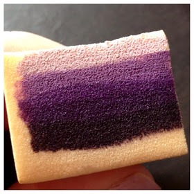 Step 2: Dampen your makeup sponge and wring out any excess water. This will help your polish stay on the surface and not soak so far into the sponge. Take your polishes, and apply a line for each color, going from light to dark.