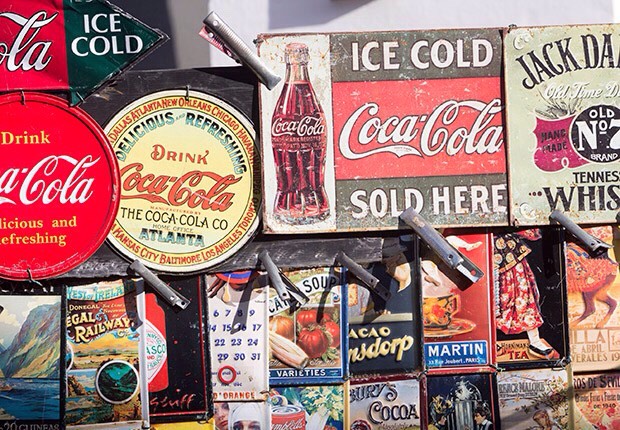 Americana' Home Décor
Watch a couple of episodes of the popular cable TV show American Pickers to get an idea of what's hot when it comes to cashing in on eclectic items for home decorating Americana-style. Vintage metal advertising signs — a popular wall hanging among Americana enthusiasts.