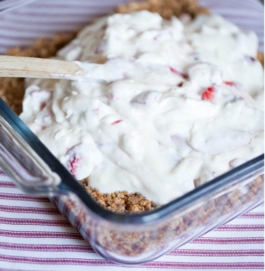 Coat the bottom of an 8x8" pan with 1/2 of the crumb crust, pour the cream mix in and coat the top with the remaining crumb crust.