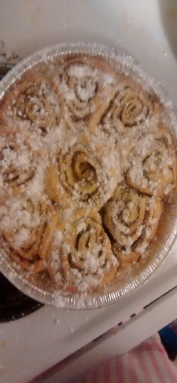 Remove pan from the oven and let the bread cool for 10 mins. Sprinkle powdered sugar on top and enjoy with coffee!