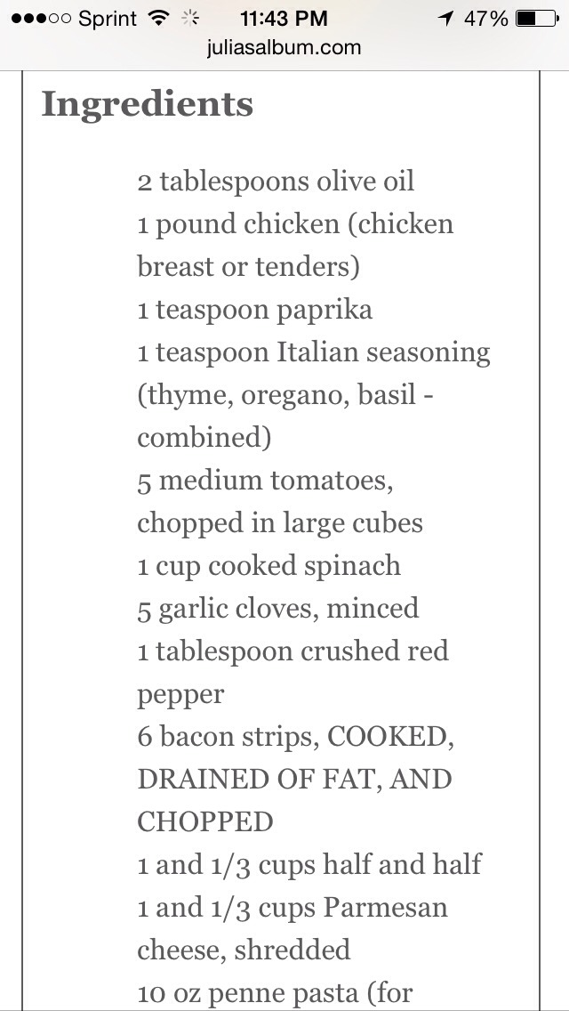 Chicken and bacon pasta with spinach and tomatoes in garlic cream sauce