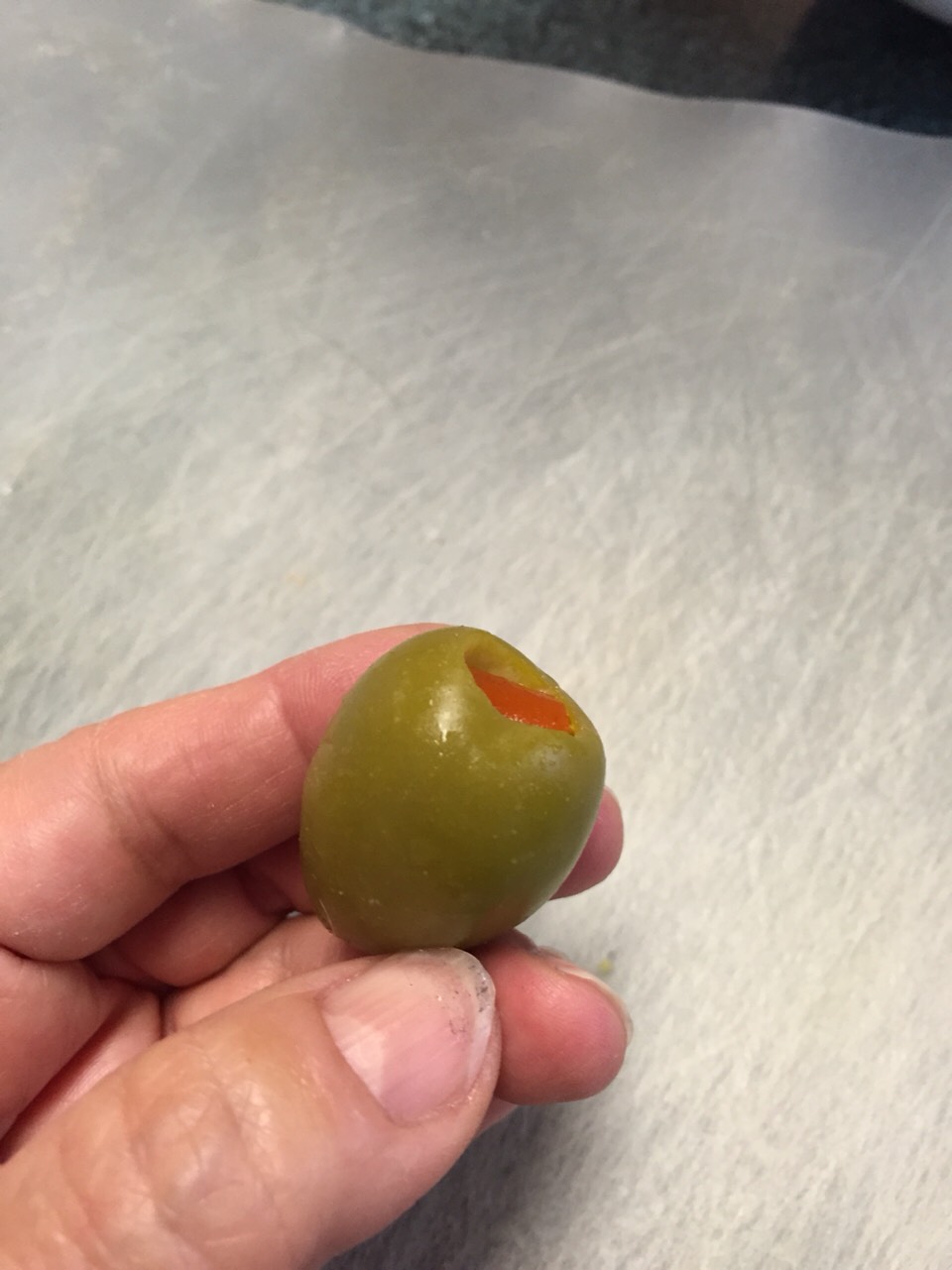 If your olives have pimentos, remove and slit