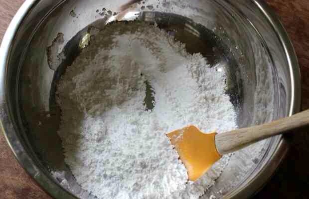First, you will combine the powdered sugar, powdered milk and salt in a large bowl and stir to combine.
