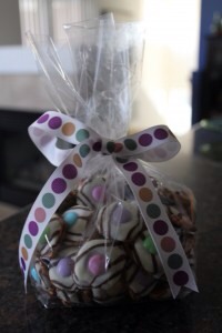 7. Place handfuls of the candies in clear plastic bags and tie on colorful ribbons.