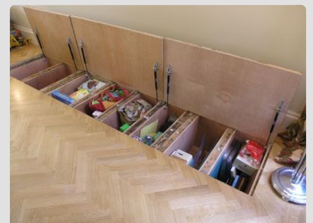 Hidden storage in between the floor joints. 