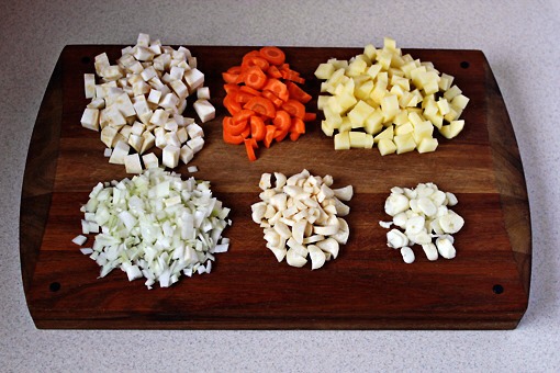 8. Here are the vegetables again. This time nicely cleaned and sliced, chopped and diced.
The celery and the potato were diced.
The carrot and parsley root were cut in half lengthwise and then sliced into little crescents.
The garlic was sliced and the shallots were chopped finely.