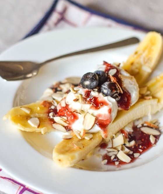 Breakfast banana split with yogurt and jam