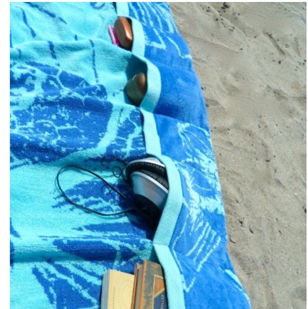 Make pockets in your towel by folding up the edge bad sewing them in various sizes.