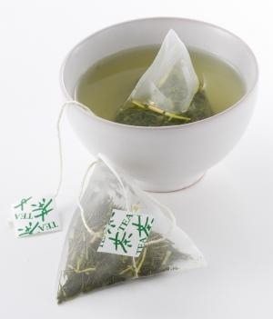 Next time you enjoy a cup of green tea, do not throw away the tea bag after. Instead, cut open, put the contents in a small bowl and add a teaspoonful of honey. Make a paste and gently massage mixture onto your face in a circular motion. Let it sit on your face for 5-10 mins before rinsing. 
-->