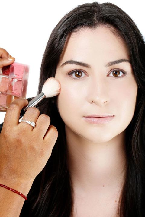 4. Apply Blush:- Swirl a coral cream blush.