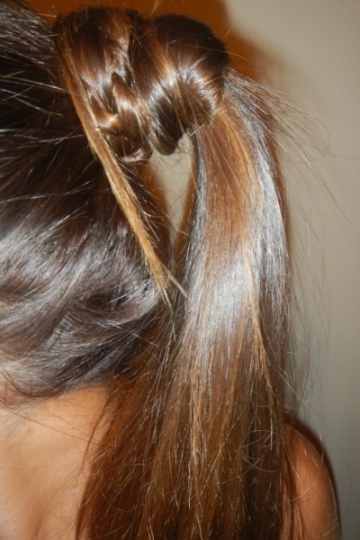 Get this look by braiding a finger-width segment of a ponytail and wrapping braid around hair band. Secure with a bobby pin.