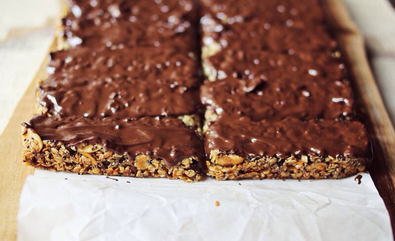 Melt the chocolate in the microwave or on the stove top. Add a thin layer of chocolate to the tops of the bars and use your spoon to spread the mixture out over the bars.