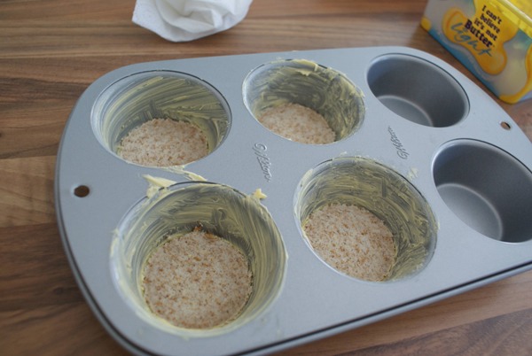 Then, cut out muffin/cupcake shaped circles and put them in a buttered cupcake pan.
