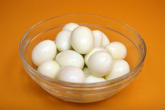 Add baking soda to the water when you hard boil eggs. It raises the pH of the water and makes them easier to peel by reducing the albumen's ability to stick to the shell.