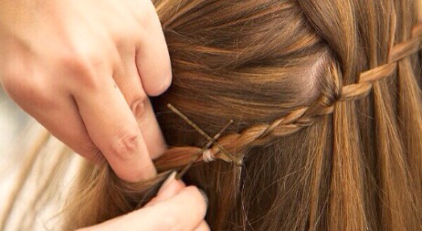 Secure the braid with a clear elastic band and add bobby pins to make stronger👑