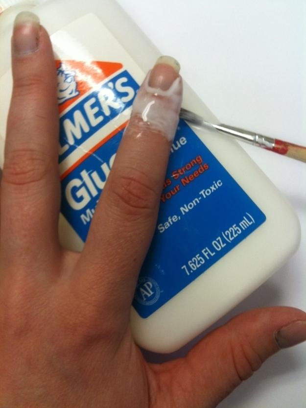 18. Apply Elmer’s glue with a thin paint brush, which peels off to reveal a perfect manicure.This is a great technique if you’re doing any kind of messy technique, like water marbling or sponging.