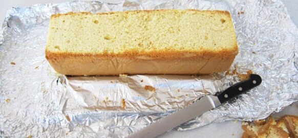 Cut off the round part of your cake, this part is just to make it easier to frost and cover in fondant
