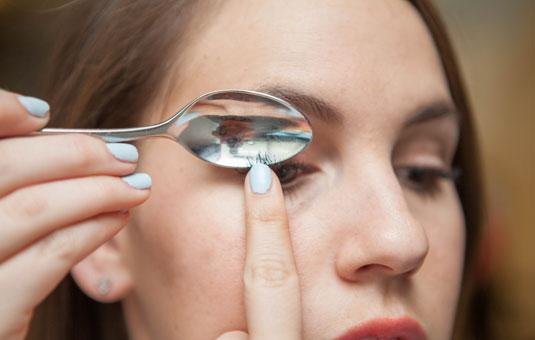 5. Curl your lashes with the edge of a spoon.