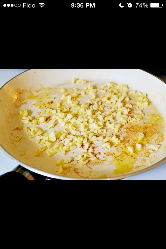 heat the olive oil over medium-high heat in a pan. add the garlic and sauté for 30 seconds