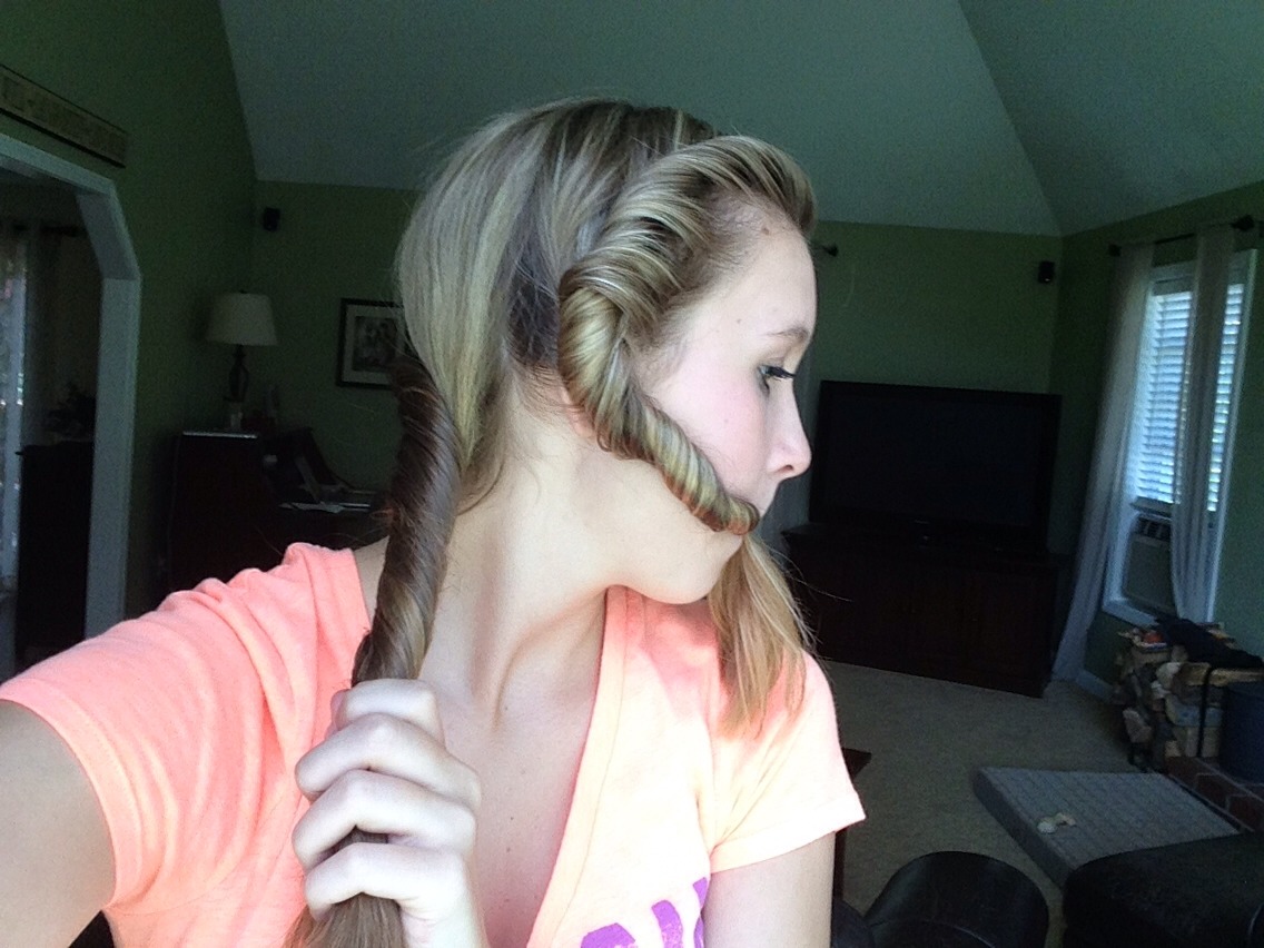 Keep going, you're almost there! Finish once you reach the end and all the hair is used in the twist. The twist should end somewhat next to the first one.