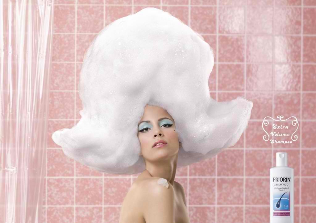 Now we don't want this much shampoo, but to make the shampoo reach its full potential, instead of rinsing out your lathered up hair, massage your scalp. Every so often pull gently on the roots of your hair. Then continue adding handfuls of warm water and massaging it in to emulsify the shampoo.