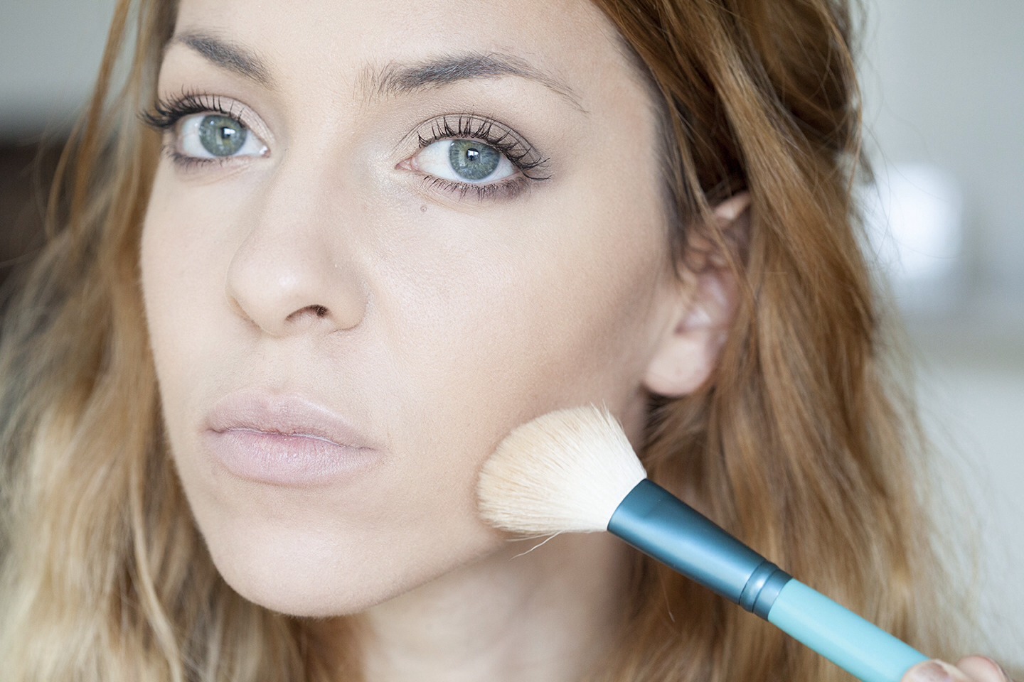 To contour cheeks, use a matte powder (a few shades darker than your skin tone) with an angled brush. Blend on temples and under cheek bone.

